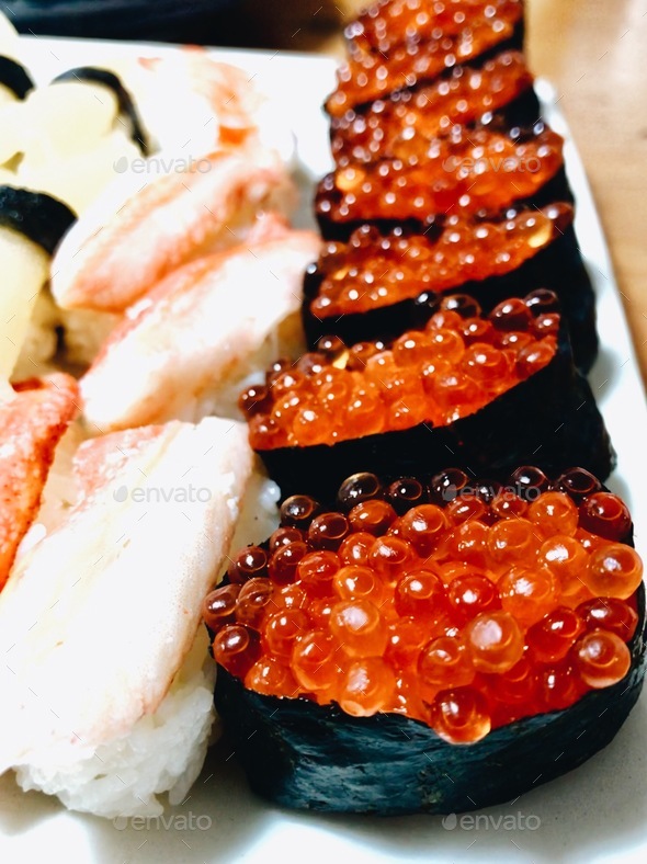 Sushi crab nigiri on the left and Ikura (cod roe) on the right. Stock