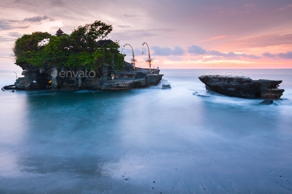 Pura Tanah Lot at sunset, famous ocean temple in Bali, Indonesia. - Stock Photo - Images