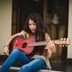 Teen girl playing guitar - PhotoDune Item for Sale
