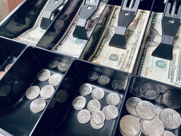 Background image of cash drawer containing $75 in bills and change.