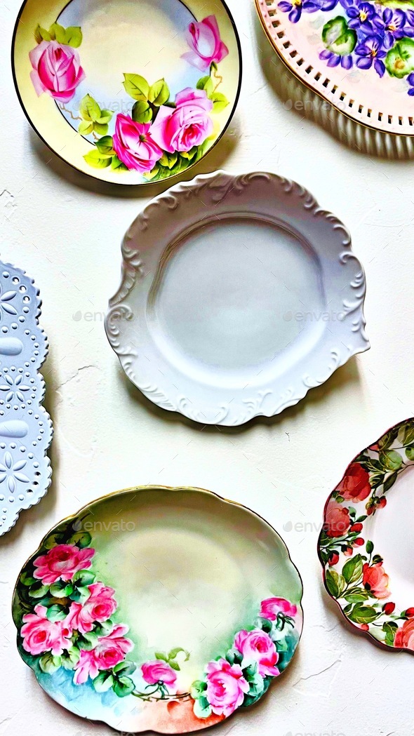 Vintage china dishes hanging on textured wall, background Stock Photo ...