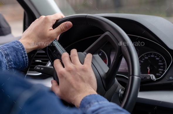 Male hand honking the car horn, man driving vehicle and beeping. Stock ...