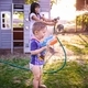 kids playing with water in the backyard - PhotoDune Item for Sale