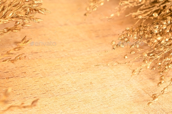 Gold color weeds arranged on wooden background an ideal invitation card for  weddings and Engagement Stock Photo by Nirastar