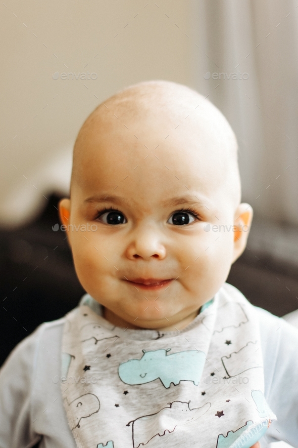 Sweet smiling baby with big eyes and chubby cheeks Stock Photo by ...