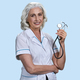 Portrait of smiling senior female doctor with stethoscope. - PhotoDune Item for Sale