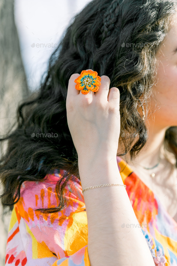 Close up of woman brushing her curly hair with her fingers Stock Photo