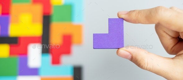 geometric shape block with colorful wood puzzle piece background. logical thinking, business logic