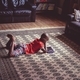 Young afro caribbean boy using a tablet in a relaxed home setting - PhotoDune Item for Sale