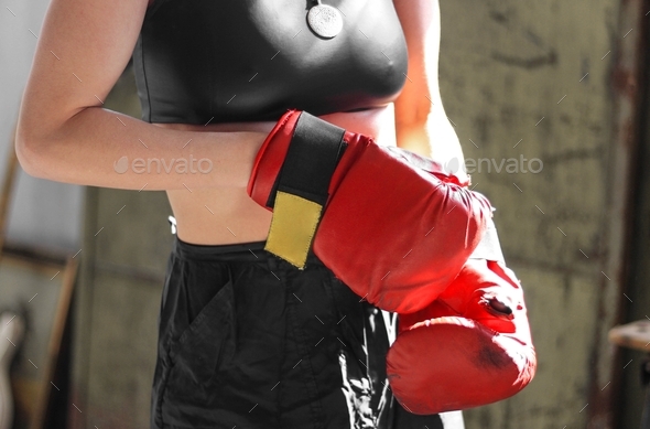 A woman with red box gloves, body part