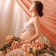 Asian woman embracing her pregnancy among colourful flowers - PhotoDune Item for Sale