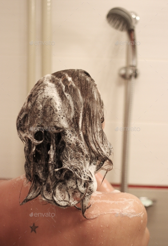 Woman under the shower, shampoo hair