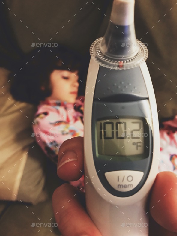 Thermometer reading for sick child. Stock Photo by wdnesday PhotoDune