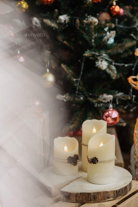 christmas tree and candles at home Stock Photo by LesiaScotch PhotoDune