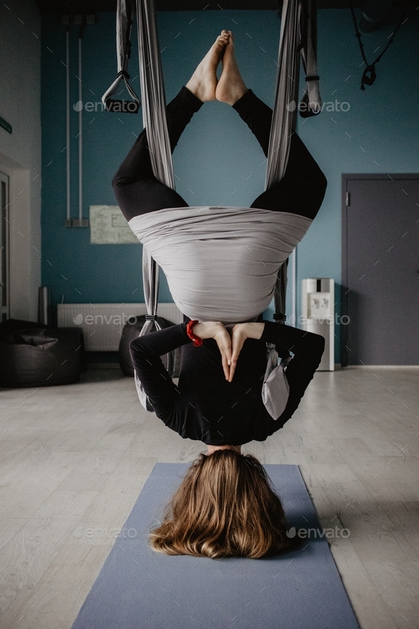 girl doing yoga / upside down / health and wellness / woman’s health