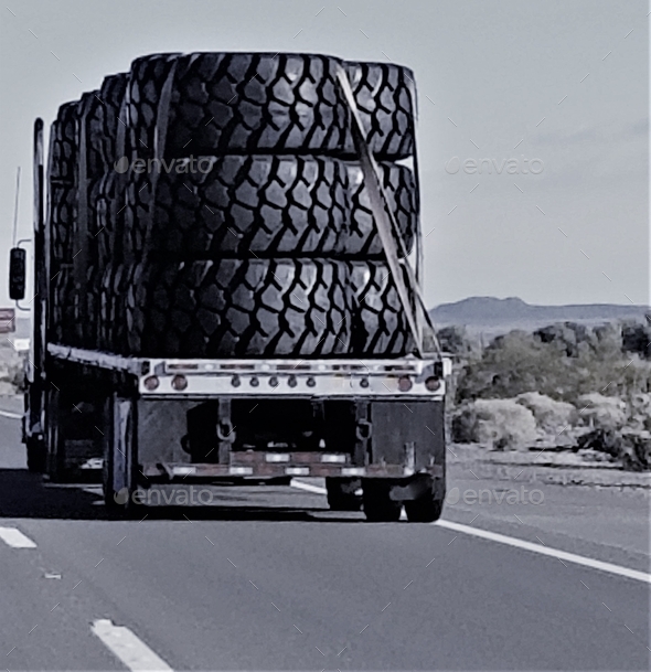 Transportation and Logistics! BIG Big Rig Tires on a Flat Bed! Stock