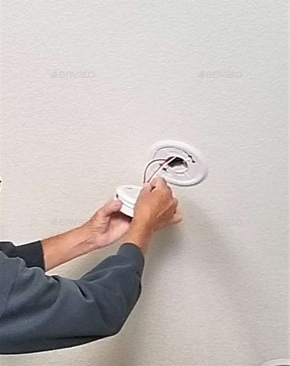 Home Improvement! Replacing Smoke Detectors! Stock Photo by AZBLT