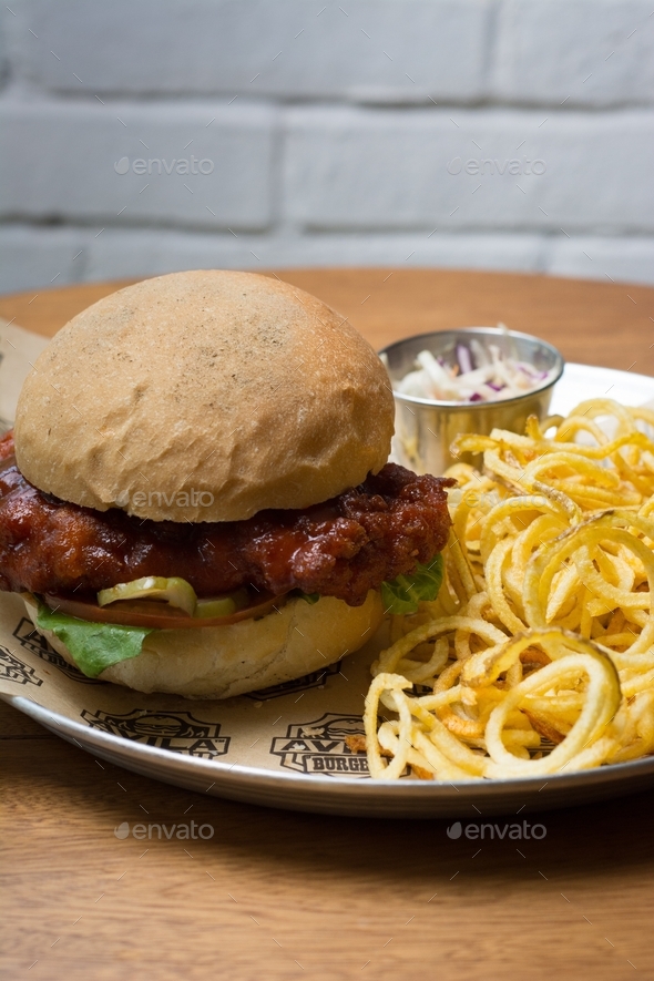 Burger with chicken breast in barbecue sauce Stock Photo by jdvolcan