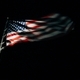 American flag emerging from the darkness with light shining on United States stars and stripes - PhotoDune Item for Sale