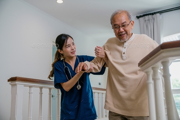 Nurse helping the elderly walk up the stairs