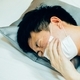 Young Asian man coughing and suffering in medical mask inside home bedroom - illness and fever - PhotoDune Item for Sale