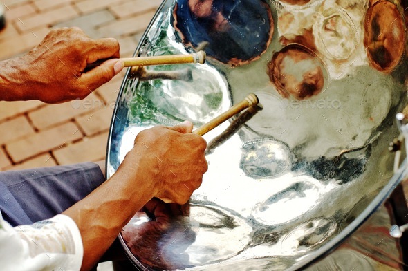 Cheerful sounding Jamaican steel drum player on the city sidewalk Stock Cheerful sounding Jamaican steel drum player on the city sidewalk Stock