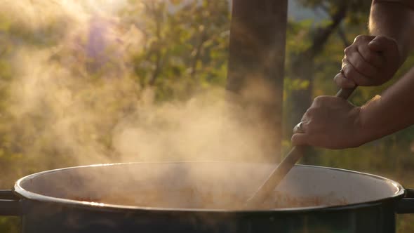 Lot of steam from the cauldron with ajvar mixture slow motion video