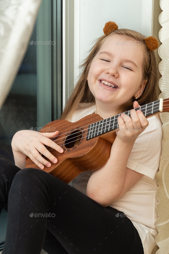 Portrait of Happy Smiling Little Girl in White T-shirt and Black