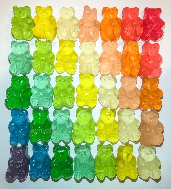 Rainbow colored gummy bears candy stacked In neat orderly Rows ...