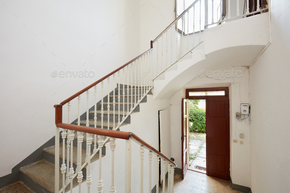 Staircase with white walls in old country house - Stock Photo - Images