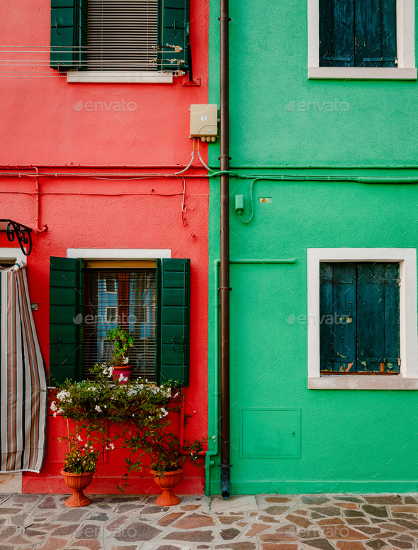 Characteristic red and green colored houses in Burano - Stock Photo - Images