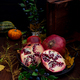 wooden basket with pomegranates and various props - PhotoDune Item for Sale