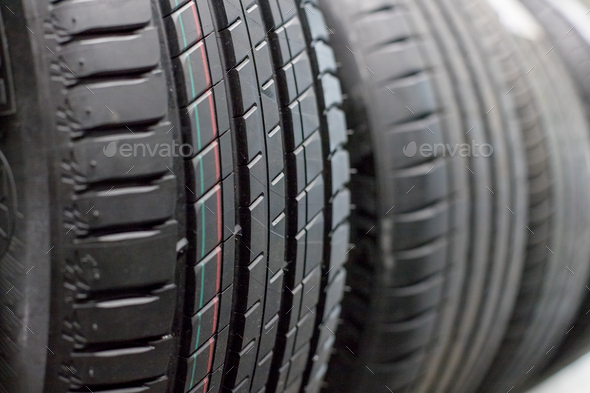 Protector of automobile tires. A number of automobile tires. Close up view on auto mobile new wheel