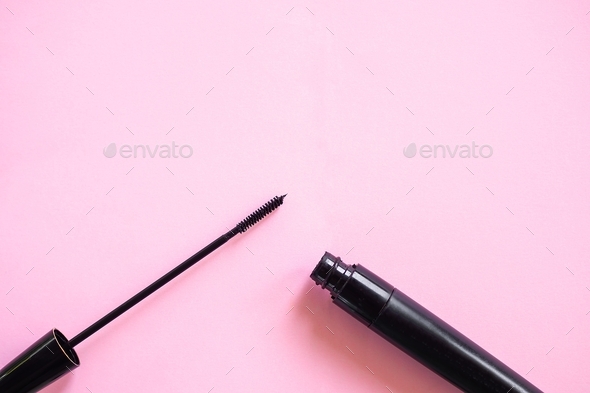 Mascara for brushing eyelashes on pink paper. cosmetic for beauty woman.