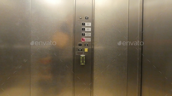 Buttons on wall inside an elevator