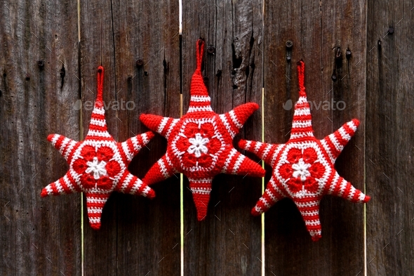 rustic style crochet stars hanging on timber fence
