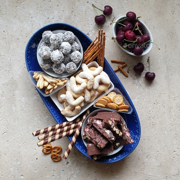 sweet food grazing platter on stone table made with rocky road,biscuits and protein bliss balls