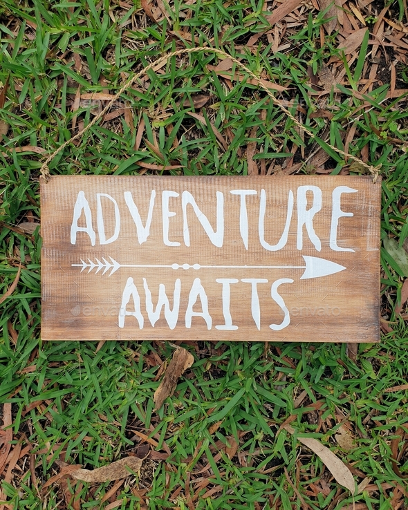 adventure awaits,inspiring quote on timber sign