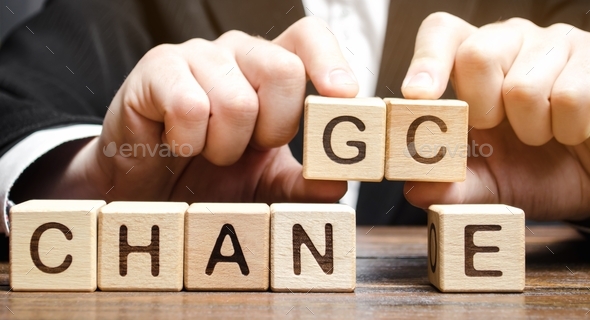 Businessman points to wooden blocks with the word Change to Chance