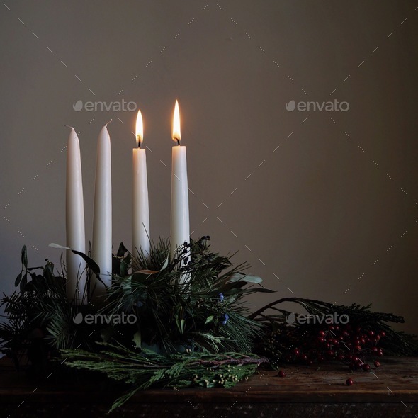 Candle light in an advent wreath Stock Photo by ehpyle PhotoDune