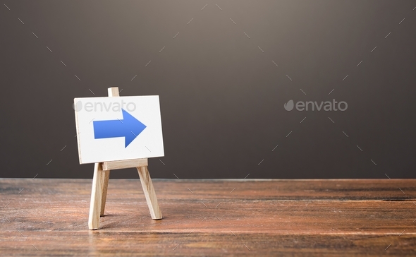 Easel with a blue right arrow. Sign of direction. Advertising of the location of a store or outlet.