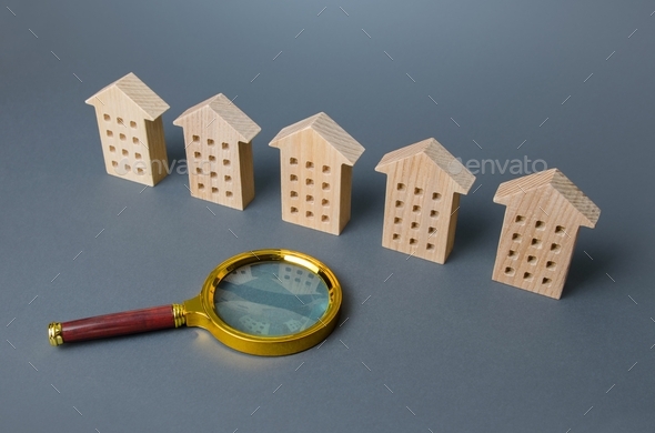 A row of identical houses and a magnifying glass.
