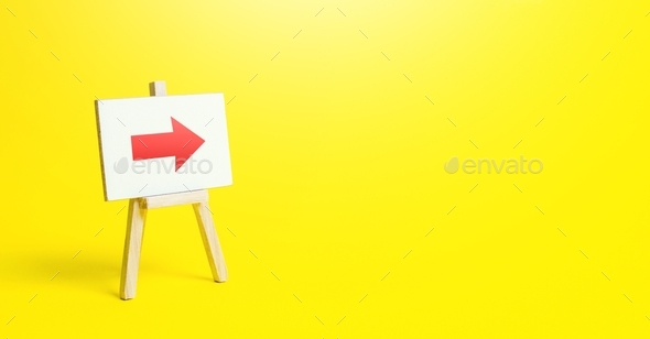 Easel with a red right arrow on a yellow background. Sign of direction. Advertising of the location