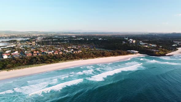 Drone panning over Lighthouse Beach, Ballina Township and Richmond river mouth. alt