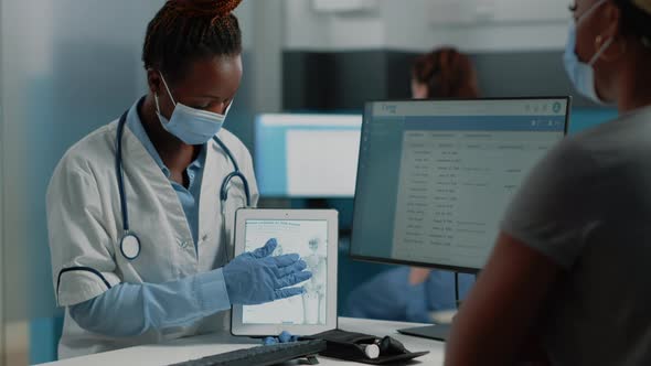 Medic Showing Tablet with Human Skeleton to Patient, Stock Footage