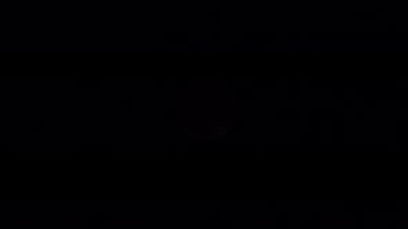 Black Clouds Passing In Front Of The Moon In The Dark Sky During A Solar Eclipse 2 alt