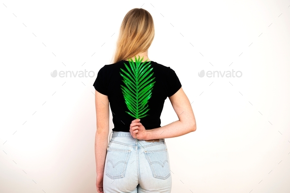 Green fern on female back,spine and woman health concept