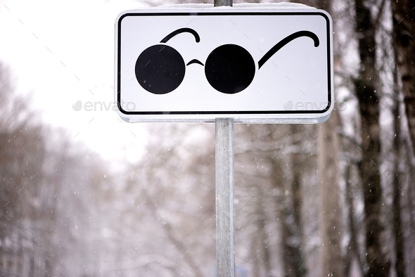 blind pedestrians sign with zebra crossing road sign on a city street during winter  - Stock Photo - Images