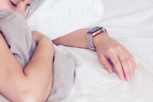 A lady sleeping and wearing apple watch - Stock Photo - Images