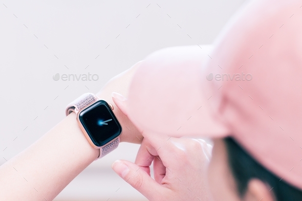 A lady using Apple watch - Stock Photo - Images
